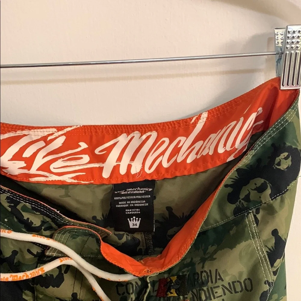 Live Mechanics Green/Blue Board Shorts with Drawstring Waist Camo Lion design.